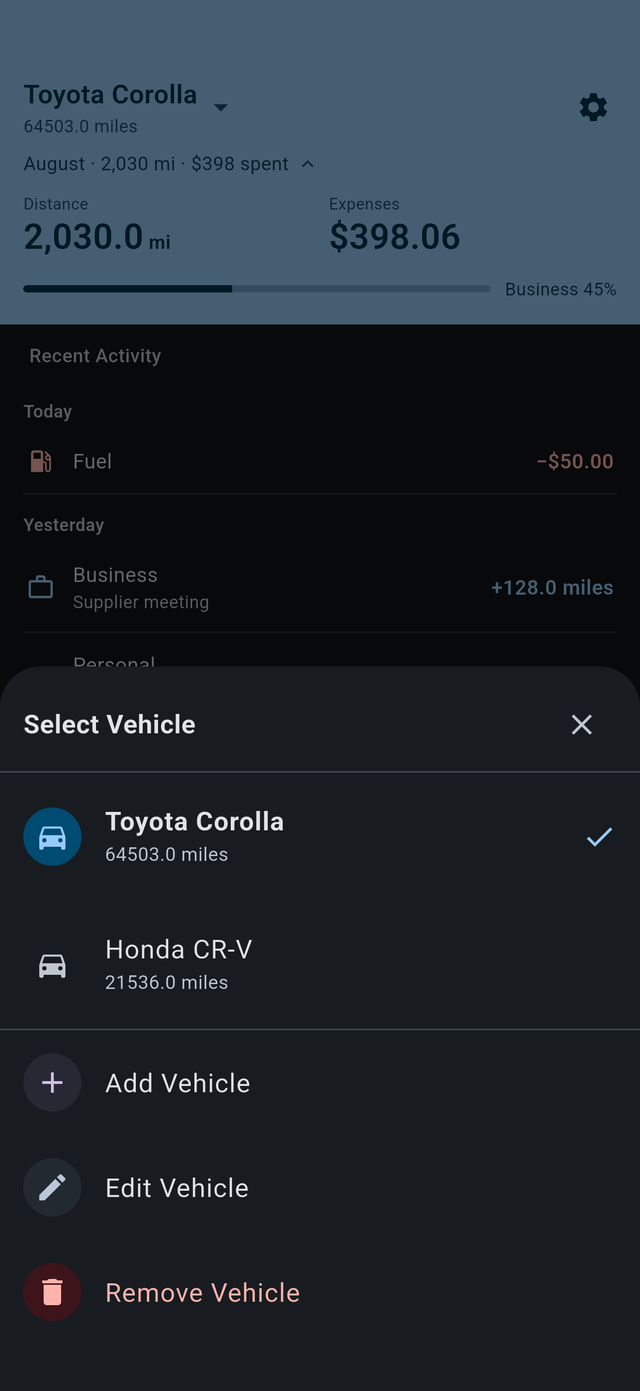 Vehicle switcher in the dark theme, listing a Toyota Corolla and a Honda CR-V with their current odometer readings